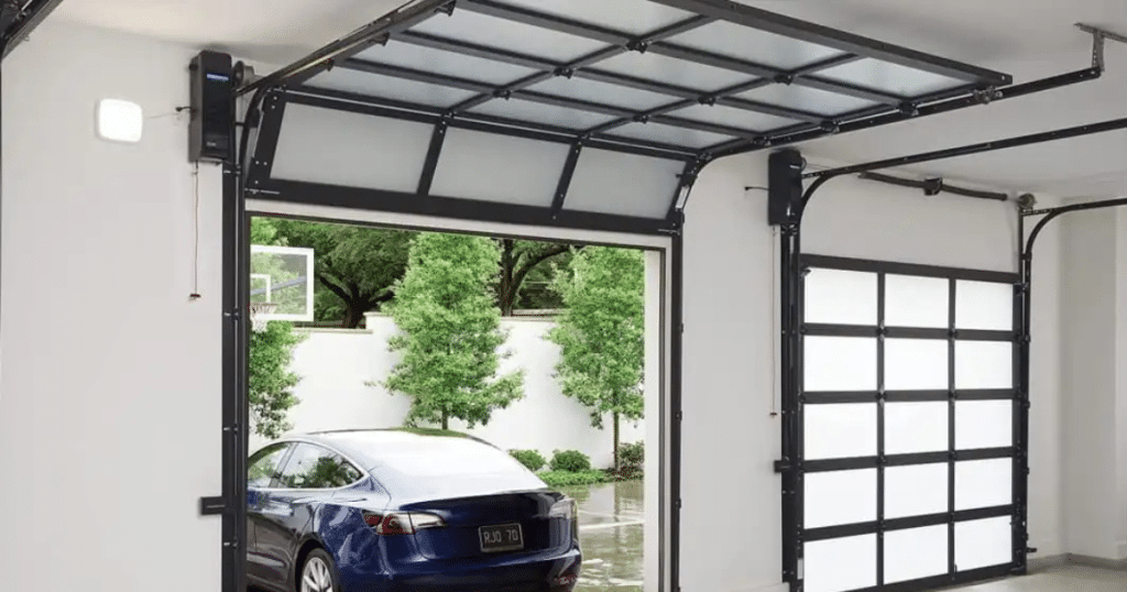 Glass-panel garage door with Tesla outside.
